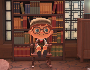 My Animal Crossing character sitting in front of a bookshelf